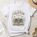A New Chapter Begins-Still Becoming T-Shirt